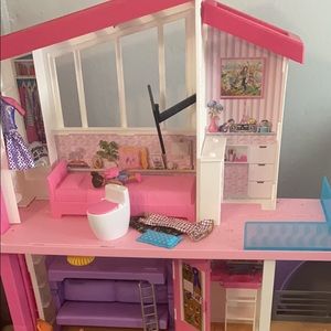 Doll house is in good condition, barely played with, have all pieces